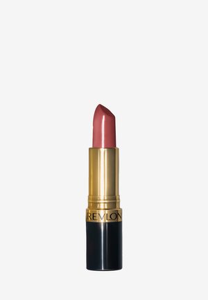 Rouge à lèvres Revlon avec une pointe lisse et arrondie dans une teinte rose doux. La base est dorée avec des accents noirs et présente le nom de la marque en gras.