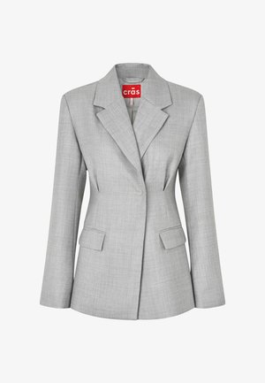 Veste cintrée gris clair avec revers crantés, deux poches avant à rabat et fermeture à un bouton, étiquetée "crās" à l'intérieur du col.