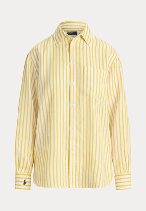 Koszula z długim rękawem z pionowymi żółto-białymi paskami, zapinana na guziki, z kieszenią na piersi i małym haftowanym logo na lewym mankiecie.
