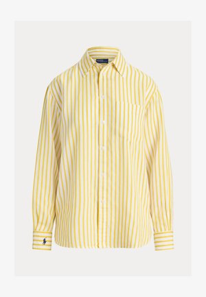 Cămașă cu mâneci lungi, cu dungi verticale galbene și albe, cu nasturi și buzunar la piept, precum și un mic logo brodat pe manșeta stângă.