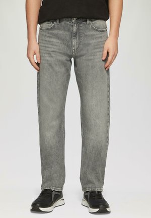 Grey denim jeans with a straight-leg fit, featuring a faded texture, five-pocket design, and stitched detailing. Worn with black sneakers.
