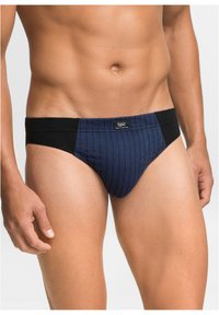 Boxer di colore blu navy con motivo a righe verticali, con vita e lati neri, realizzati in un tessuto liscio.
