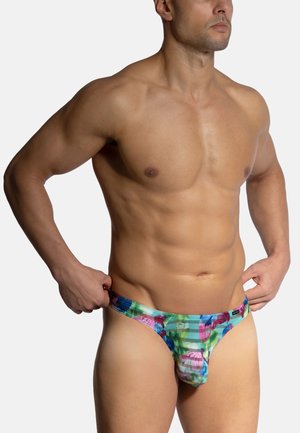 Farbenfrohe Schwimmslips mit einem abstrakten Muster in Blau, Pink und Grün. Hergestellt aus einem glatten, dehnbaren Material mit einem niedrigen Bund.