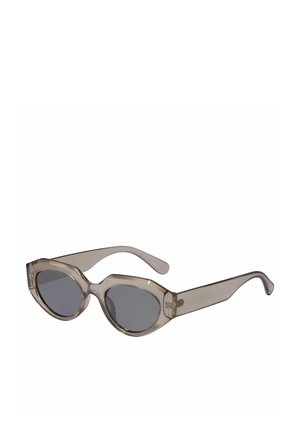 Transparent grey sunglasses with an angular, cat-eye design, featuring dark lenses and sleek, smooth arms.