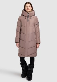 Long, puffer coat in muted mauve with a high collar, horizontal quilted pattern, two side pockets, and a zippered sleeve pocket. Black accents.