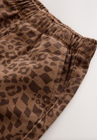 Ikke valgt, tan leopard print