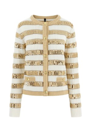 Kardigan w poziome beżowe i białe paski, złote cekiny, złote guziki oraz dwie małe przednie kieszenie. Prążkowana struktura.