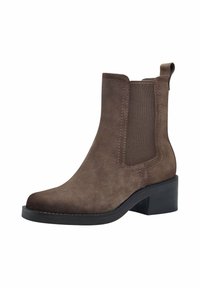 Bottine en daim marron avec panneaux latéraux élastiques, bout arrondi et petit talon bloc. Tige texturée avec détails de surpiqûres contrastantes.