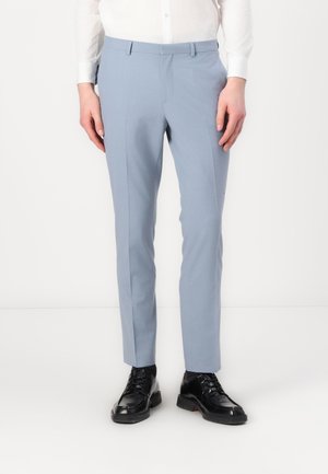 Light blue tailored trousers with a smooth texture, straight cut, belt loops, and a flat front design, paired with black shoes.