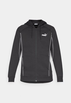 Čierna športová mikina na zips s kapucňou na sťahovanie, bielym akcentovým lemovaním a logom Puma na hrudi. Vyrobená z mäkkého športového materiálu.
