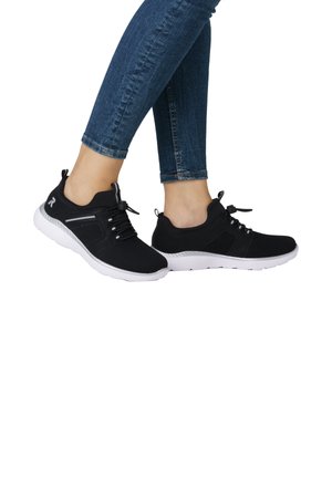 Black athletic shoes with mesh upper, white textured sole, round toe, and laces. Features subtle side accents and a pull tab on the heel.