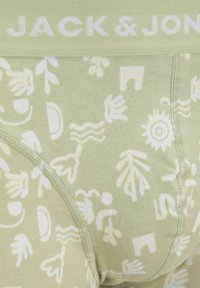 Herren Boxerbriefs aus lichtgrünem Stoff mit weißen abstrakten Mustern, einem weichen elastischen Bund mit "JACK & JONES" Branding und flachen Nähten.