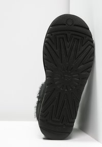 Alle Ugg mini bailey button bling im Blick