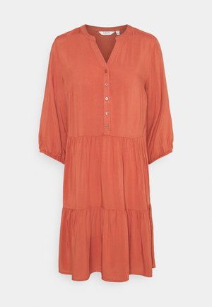 Rust-colored, long-sleeve dress with a buttoned neckline and tiered skirt. Made of lightweight fabric with a smooth texture.