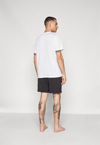 Puma STUDIO FOUNDATION SHORT - Spordišortsid - black