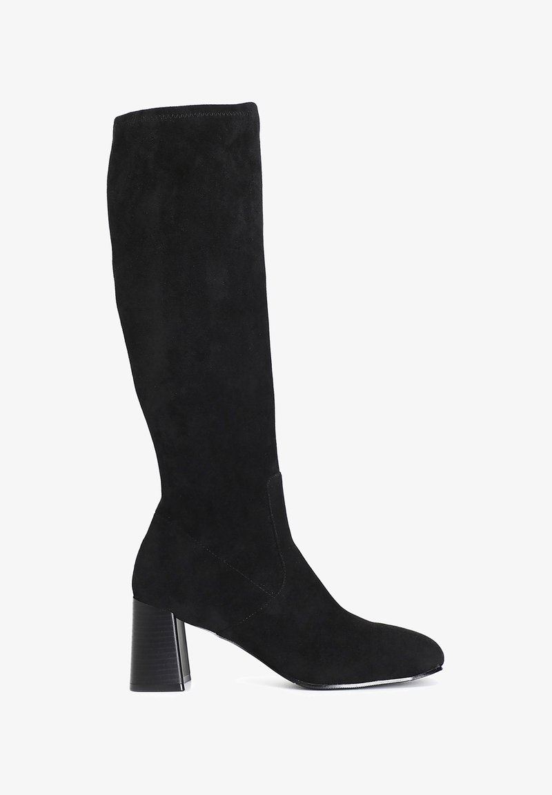 Black suede knee-high boot with a pointed toe, block heel, and smooth texture. Designed with minimal stitching and a fitted silhouette.