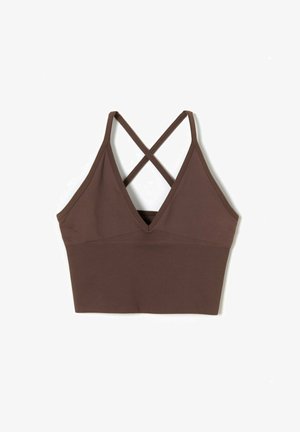 Brun ribbet bralette med dyb V-udskæring, justerbare krydsede stropper og en tætsiddende silhuet. Glat tekstur, ingen synlig hardware.