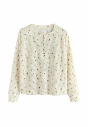 Dlhý rukáv, krémová pulóvrová košeľa s rebrovanou textúrou, vybavená gombíkovým klinom a kvetinovým vzorom v pastelových farbách.