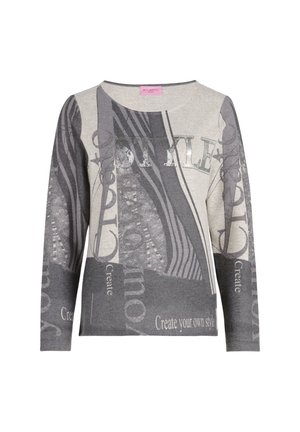 Långärmad tröja i grått och beige med en blandning av mönster, med texten "STYLE" och "Skapa din egen stil" i metallisk tryck.