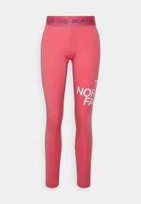 Rosa leggings i elastiskt material, med en bred midja med blå text och stor vit logotyp på vänster ben.