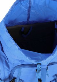 Blue fabric backpack features a spacious main compartment with a drawstring closure, interior pocket, and smooth texture.