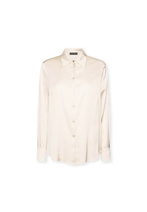 Camicia lunga in seta beige con colletto a punta e chiusura a bottoni, caratterizzata da una texture liscia e un orlo curvato per un fit rilassato.