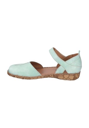 Mint green leather shoe with open sides and a crisscross strap. Natural cork-like sole with light stitching details. Flat design.