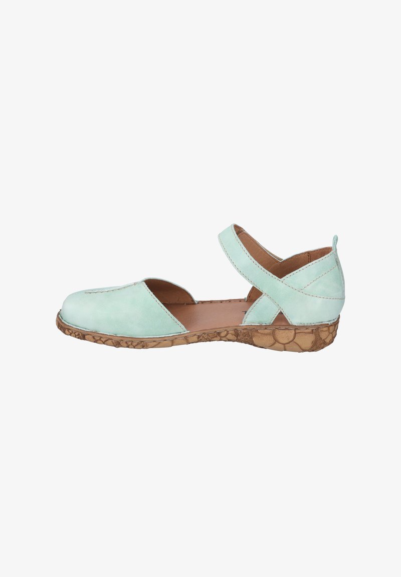 Mint green leather shoe with open sides and a crisscross strap. Natural cork-like sole with light stitching details. Flat design.