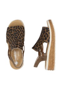 Leopard print sandals with a beige and brown color scheme, open toe design, and a cork-like wedge sole with white accents.