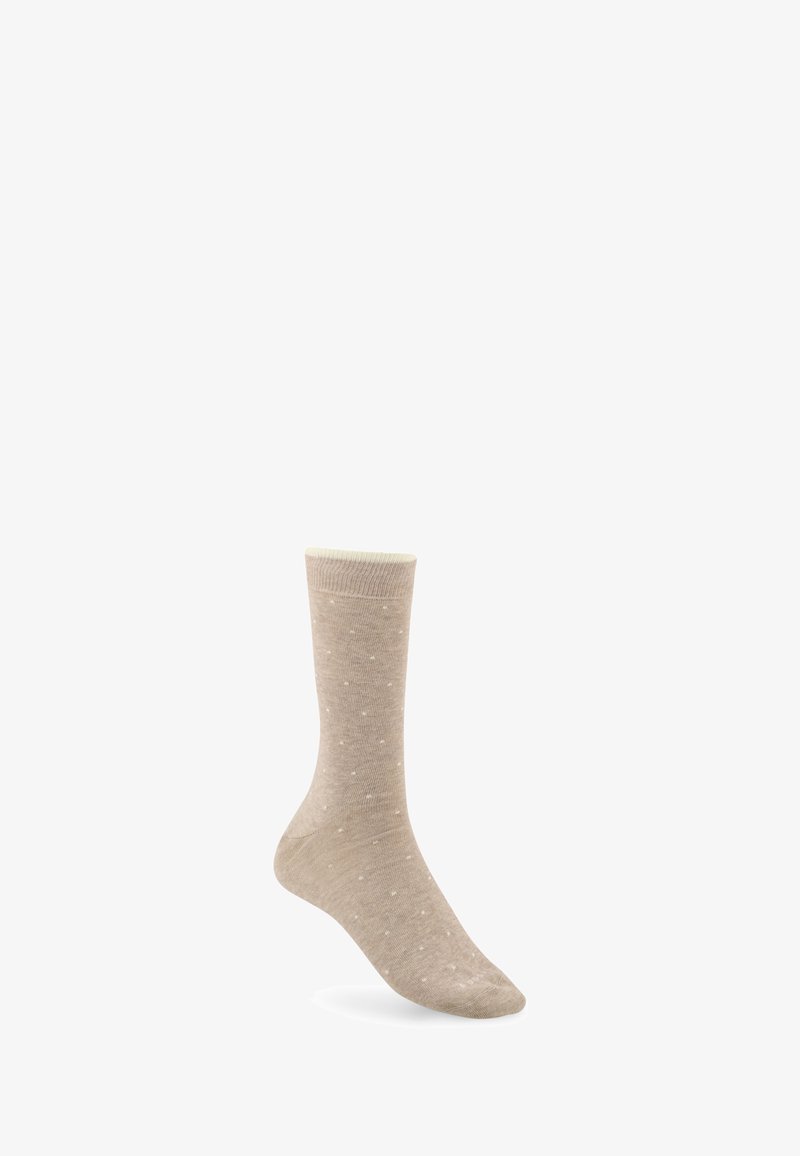 Chaussette beige à petits pois blancs, longueur mi-mollet, présentée sur fond blanc.