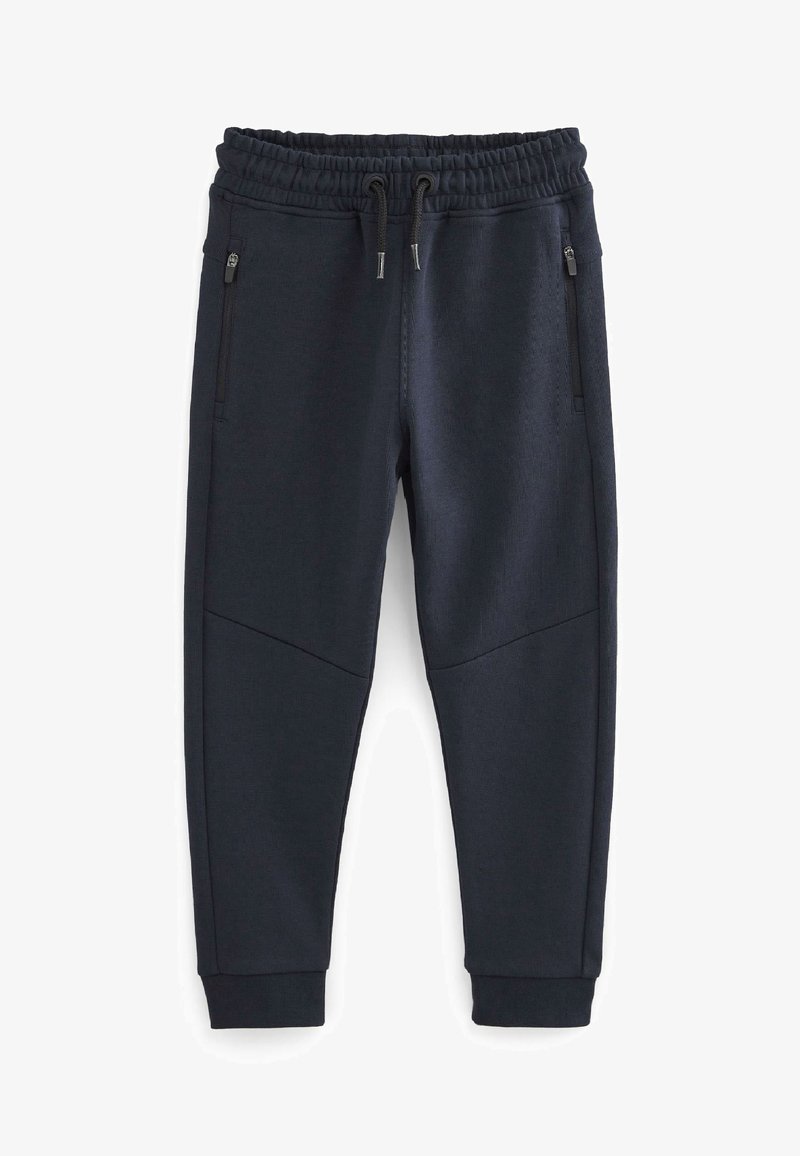 Marine joggers med elastisk talje, justerbar snor, tapered ben og to sidelommer med lynlås. Struktureret stof med sømdetaljer.