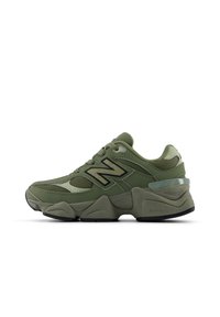 Olive green New Balance sneakers with mesh and synthetic overlays, featuring a chunky sole and prominent 'N' logo in black.