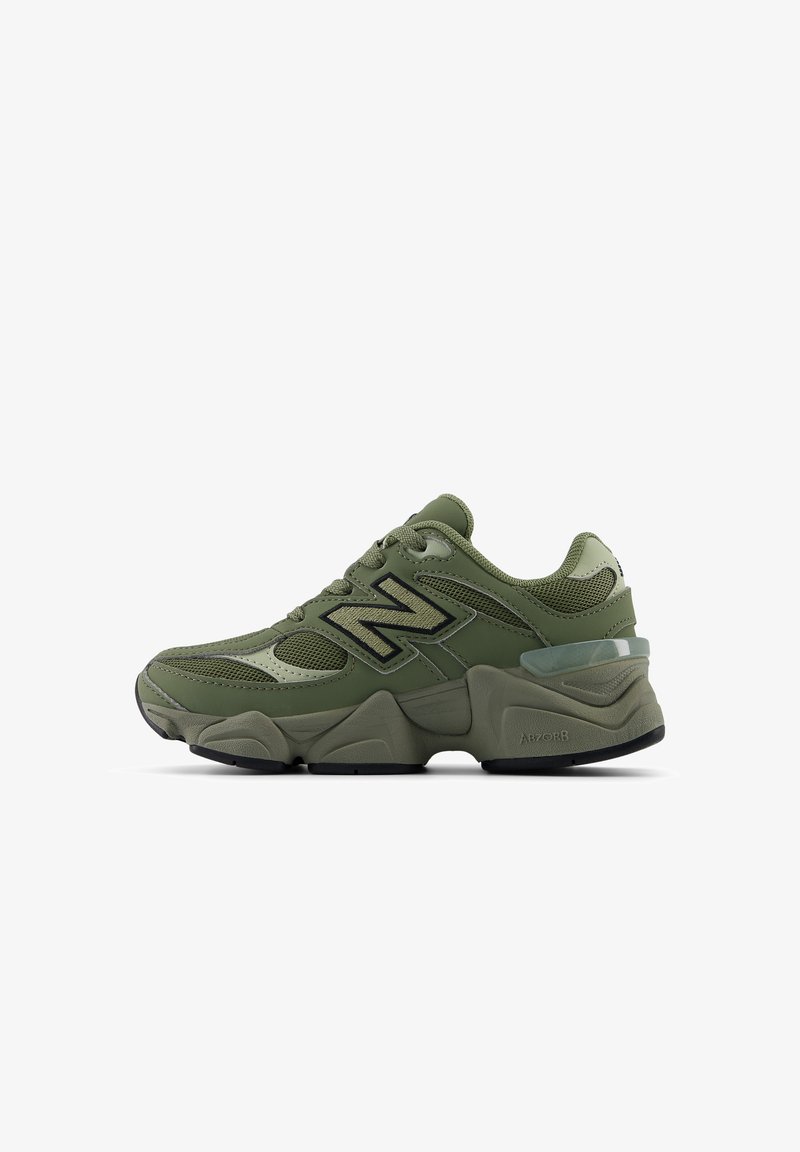 Olive green New Balance sneakers with mesh and synthetic overlays, featuring a chunky sole and prominent 'N' logo in black.