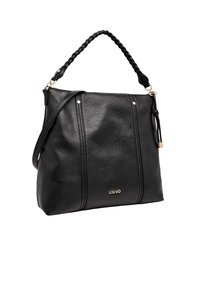 Sac à main en cuir noir avec une finition texturée, anse supérieure tressée, bandoulière amovible et ferrures dorées. Logo de la marque affiché de manière bien visible.