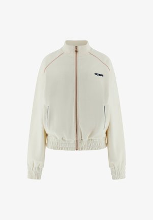 Cremefarbene Jacke mit Reißverschluss, elastischen Bündchen und Saum, Seitentaschen, dezenten pinken Nähten und kleinem "GUESS"-Logo auf der linken Brust.