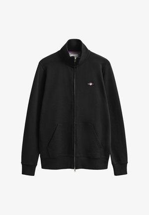 Black zip-up jacket with stand collar, front pockets, and small embroidered logo on the left chest.