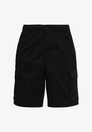 Mustad kaubapüksid elastse vöökohaga, nööbiga kinnitatav ja esiküljel klapiga taskutega mõlemal küljel.