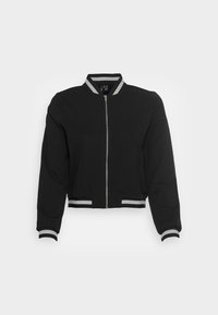 Černá bomber bunda se zipem vpředu, žebrovaným límcem a manžetami. Má šedé pruhy na límci a lemu, vyrobená z měkké látky.