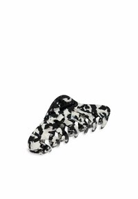 Clips per capelli a scatto in bianco e nero, realizzati in plastica lucida, con una forma curva e otto artigli per una presa sicura nella pettinatura.