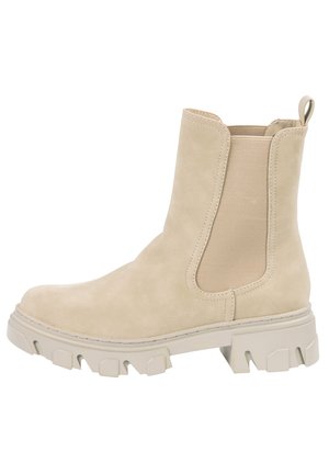 Beige ruskinds Chelsea-støvle med chunky tekstureret sål, elastiske sidepaneler og trækflap bagpå.