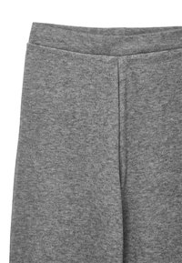 Les leggings en mélange de coton gris présentent une large taille et une texture lisse, avec un design simple et sans motifs ni accents visibles.