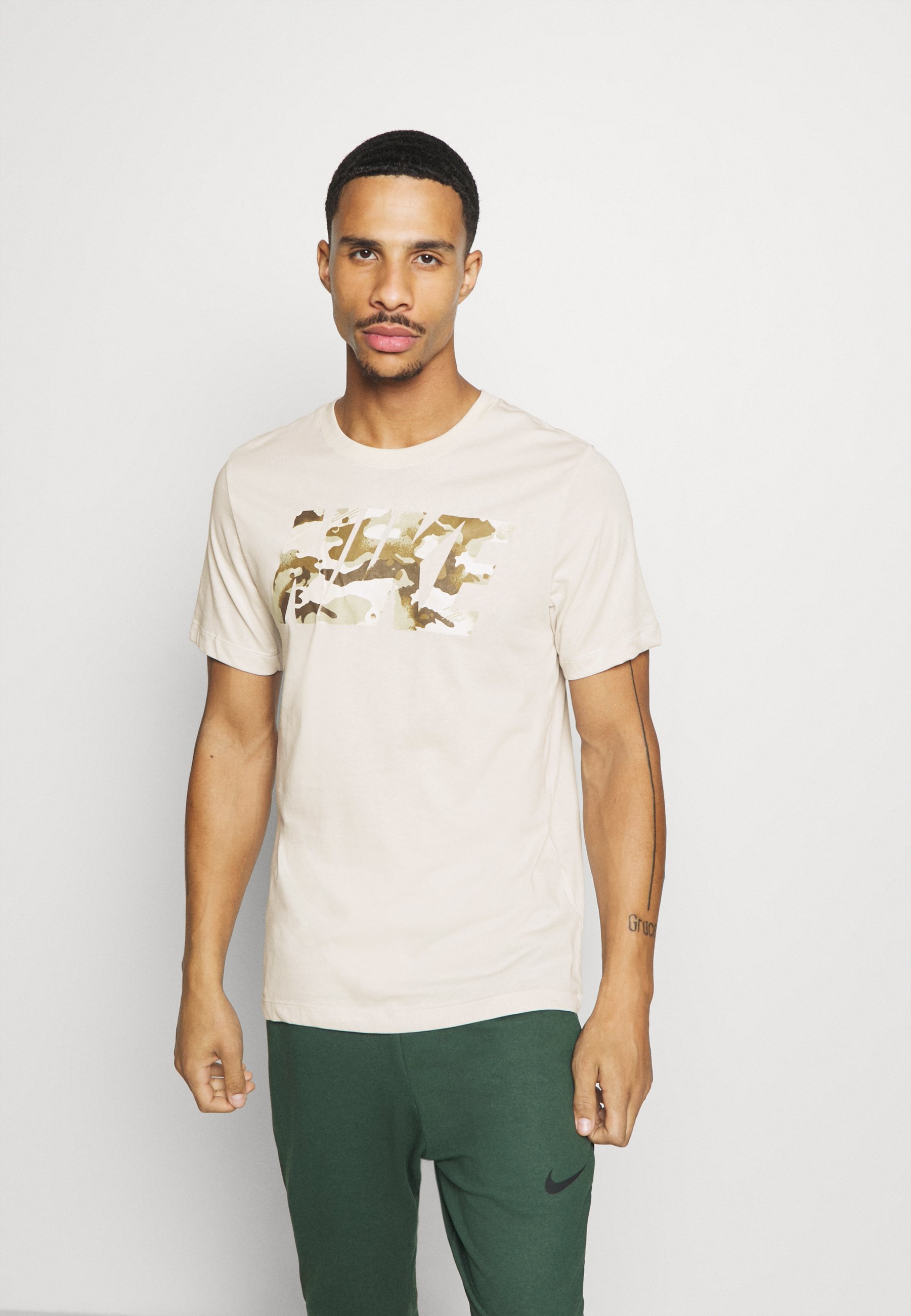 light bone nike shirt