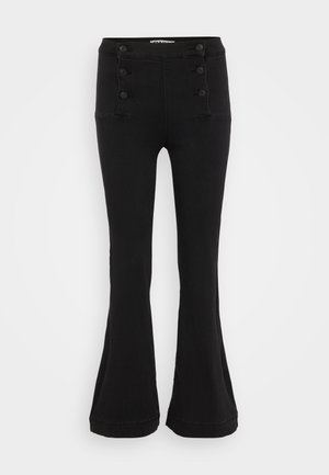 Black flared pants made of denim, featuring a high waist, five-button front closure, and two front pockets with decorative stitching.
