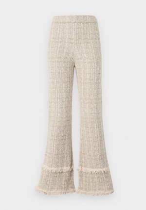 Wide-leg pants in a textured beige fabric, featuring fringed hems and a high waistband. The design offers a relaxed fit and ample drape.