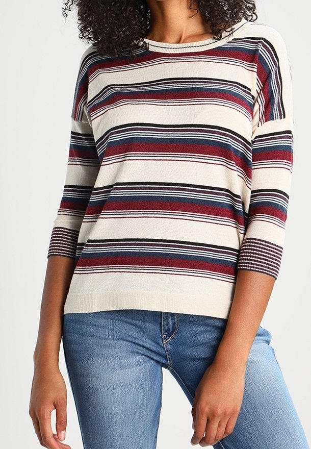 Striped sweater in cream, featuring red, navy, and black horizontal lines. Soft fabric, three-quarter sleeves, and crew neckline.