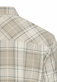 Beige ternet skjorte med lyse og mørkegrå rutemønstre, skjult knaplukning og blød tekstur. Fokus på bagsiden med sømdetalje.