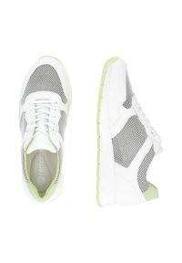 White athletic shoes with mesh inserts, green accents, and textured rubber soles. Features a lace-up design and padded collar for comfort.
