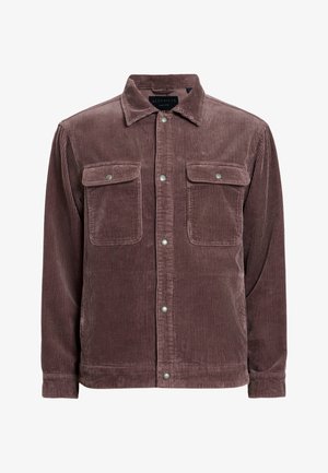 Brązowa kurtka kordurowa z kołnierzykiem, dwiema kieszeniami na piersi i zatrzaskami. Pionowa struktura żebrowa na całej powierzchni.