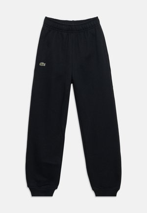 Pantalon de jogging noir à taille élastique avec bords-côtes aux chevilles et petit logo crocodile vert sur la cuisse gauche.