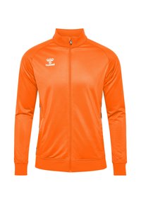 Orange sportsjakke lavet af glat, letvægtsstof. Har højt krave, fuld lynlås og sidelommer med kontrasterende detaljer i sort.